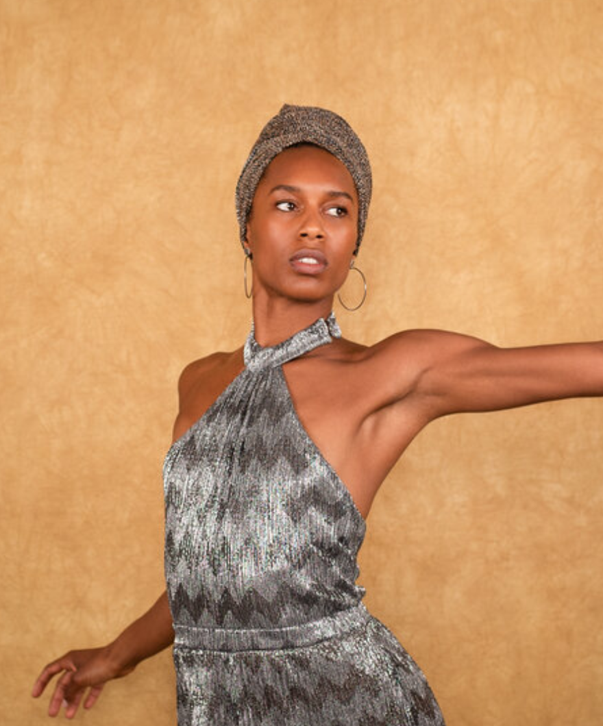 A.I.M dancer with arm outstretched.