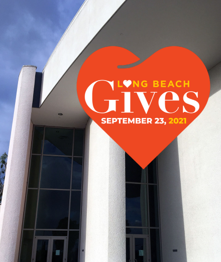 An image of a heart and the words Long Beach Gives superimposed over the exterior of the Carpenter Center building.