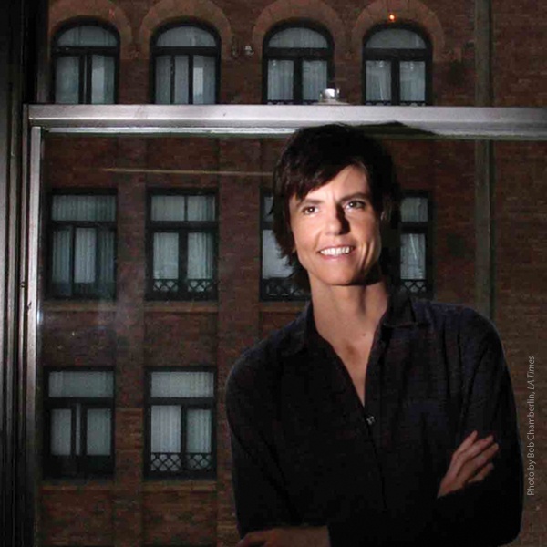 14-tig-notaro.jpg Tig Notaro standing beside a window at night.