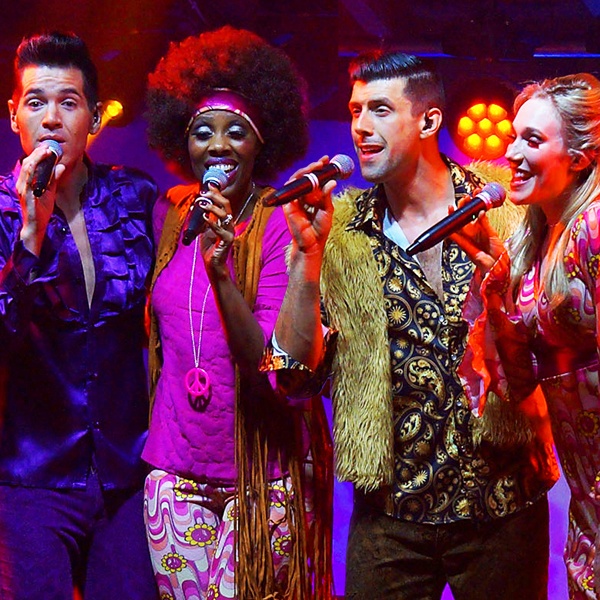 15-yesterday-once-more.jpg Members in '60s and '70s fashion singing into microphones.