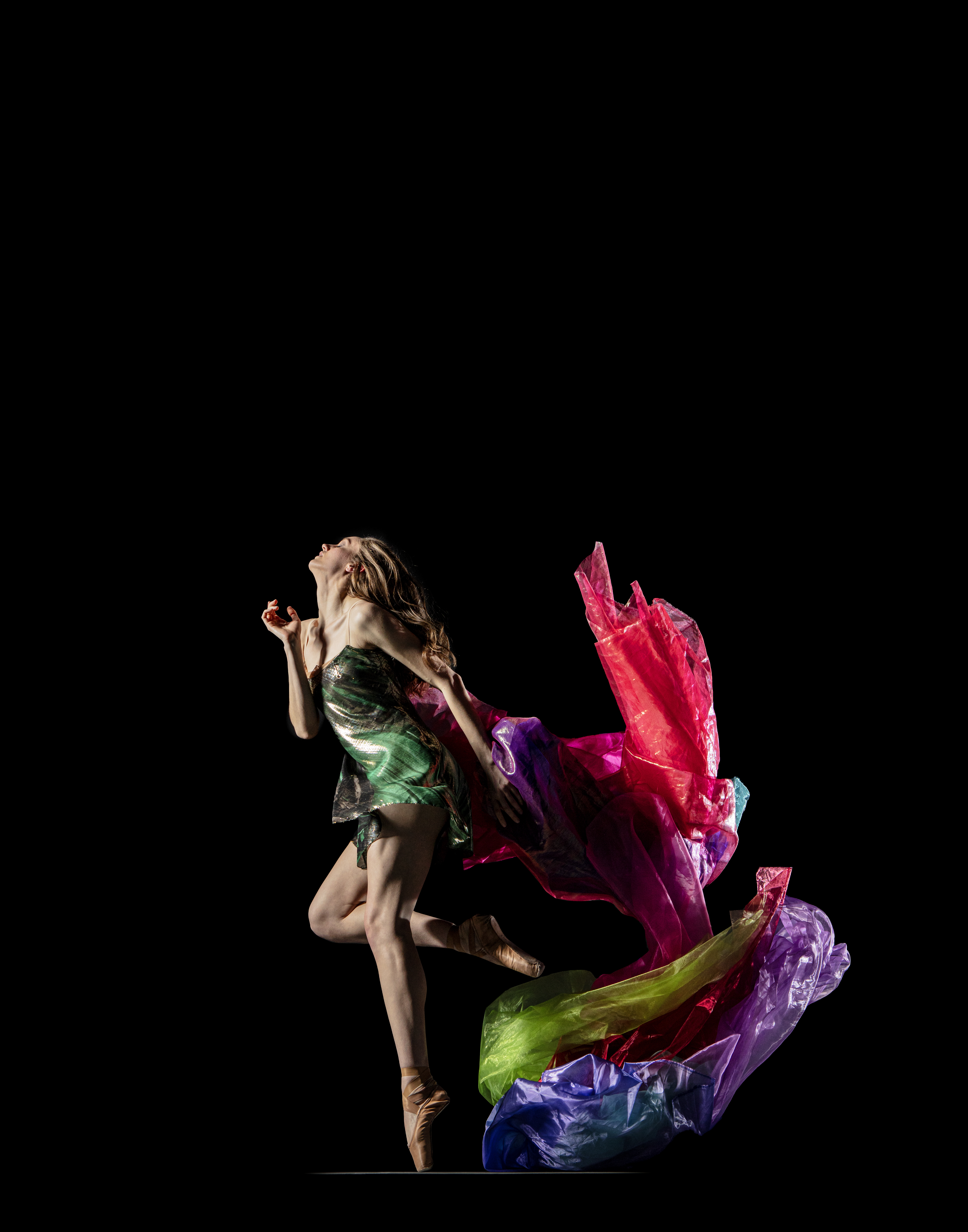 Tatum Quiñónez dancing against a dark background
