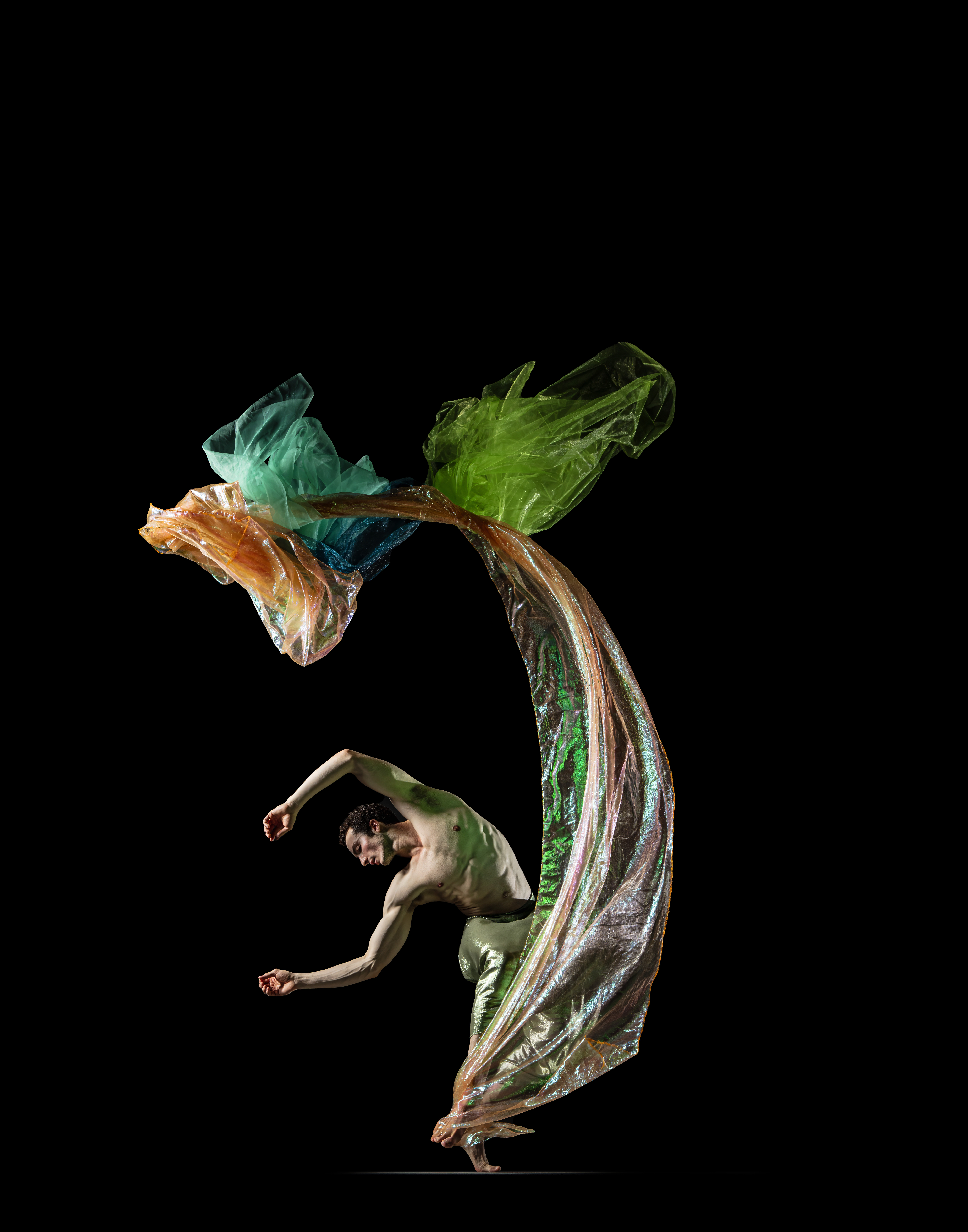 Theo Duff dancing against a dark background