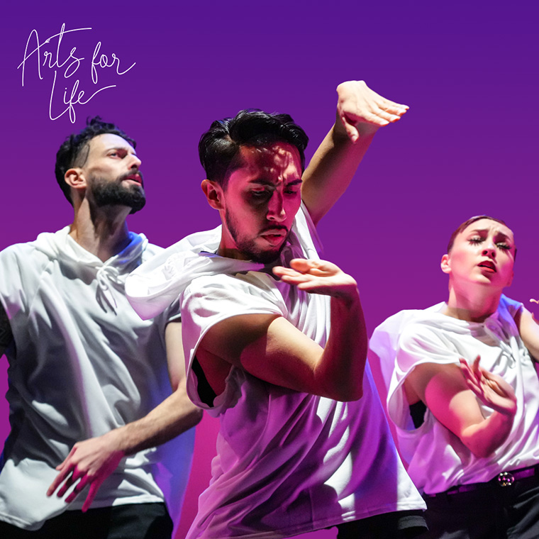 Three dancers from Versa-Style in white tops performing against a purple background