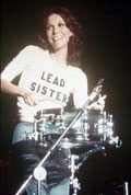 Karen Carpenter at the drums wearing her Lead Sister shirt.