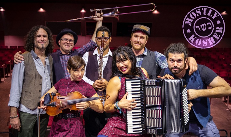 mostly-kosher-760px-450px.jpg Mostly Kosher members posing with their instruments.
