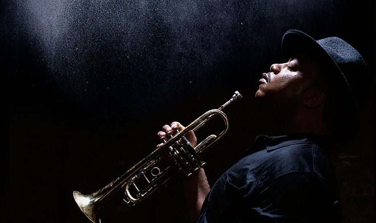 nicholas-payton-760px-450px.jpg Nicholas Payton in profile holding a trumpet.