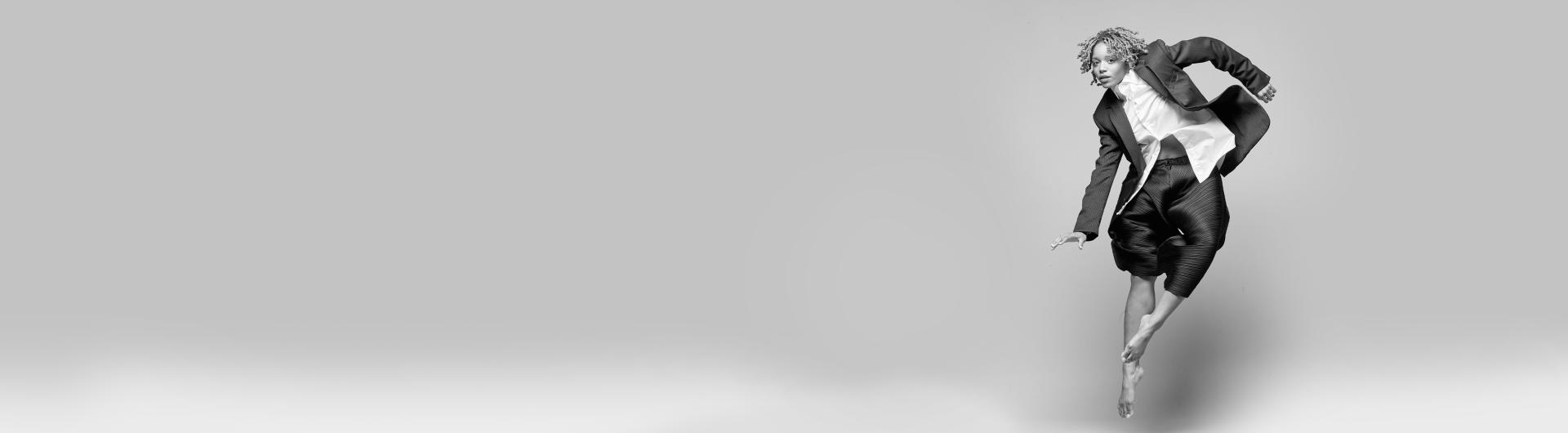 A dancer from A.I.M in mid-air