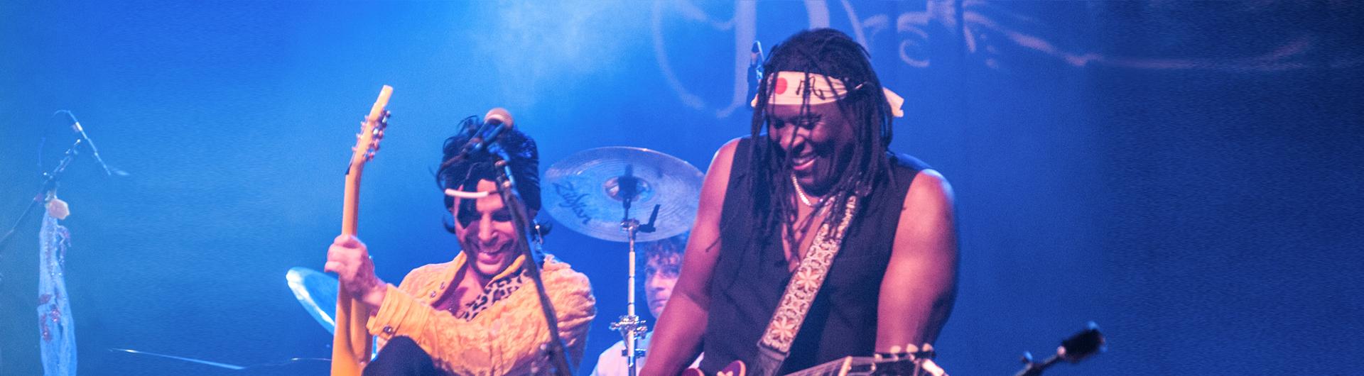 Two members of Purple Xperience playing on stage.