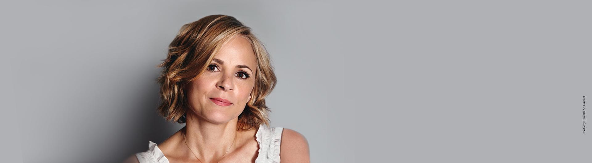 Amy Sedaris in a white top.