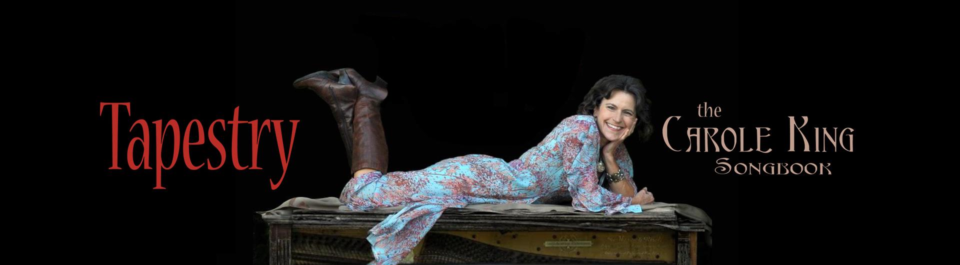 A smiling Suzanne O Davis lies face down on top of an upright piano in a dress and boots. The Text around her reads: Tapestry, the Carole King Songbook