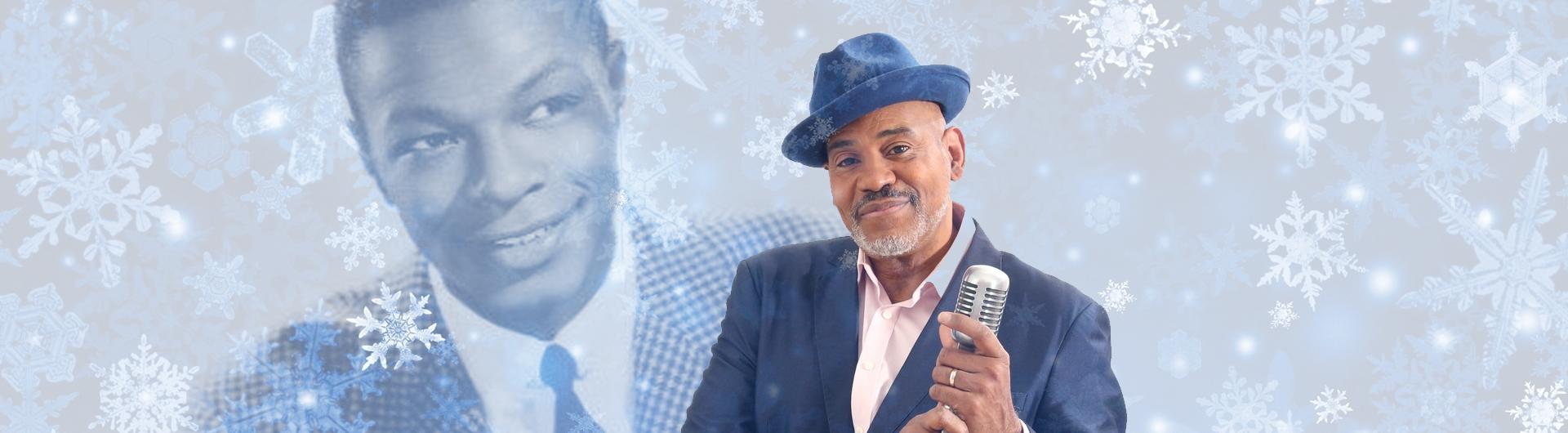 Allan Harris in a blue suit and hat stands in front of a microphone. Illustrated snowflakes fall behind him where there's also a screened back image of Nat King Cole.