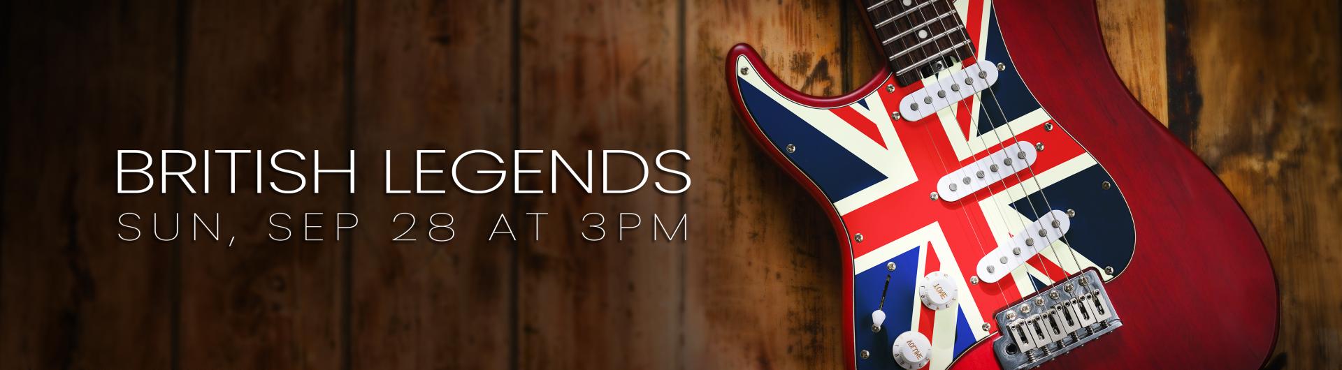 An electric guitar with the U.K. flag against a wood background