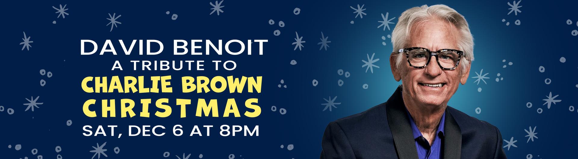 David Benoit in glasses against a snowflake background 