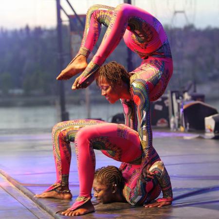 Two members of Cirque Kalabente demonstrating contortion on stage
